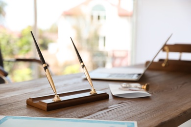 Office pen holder on desk in notary's office