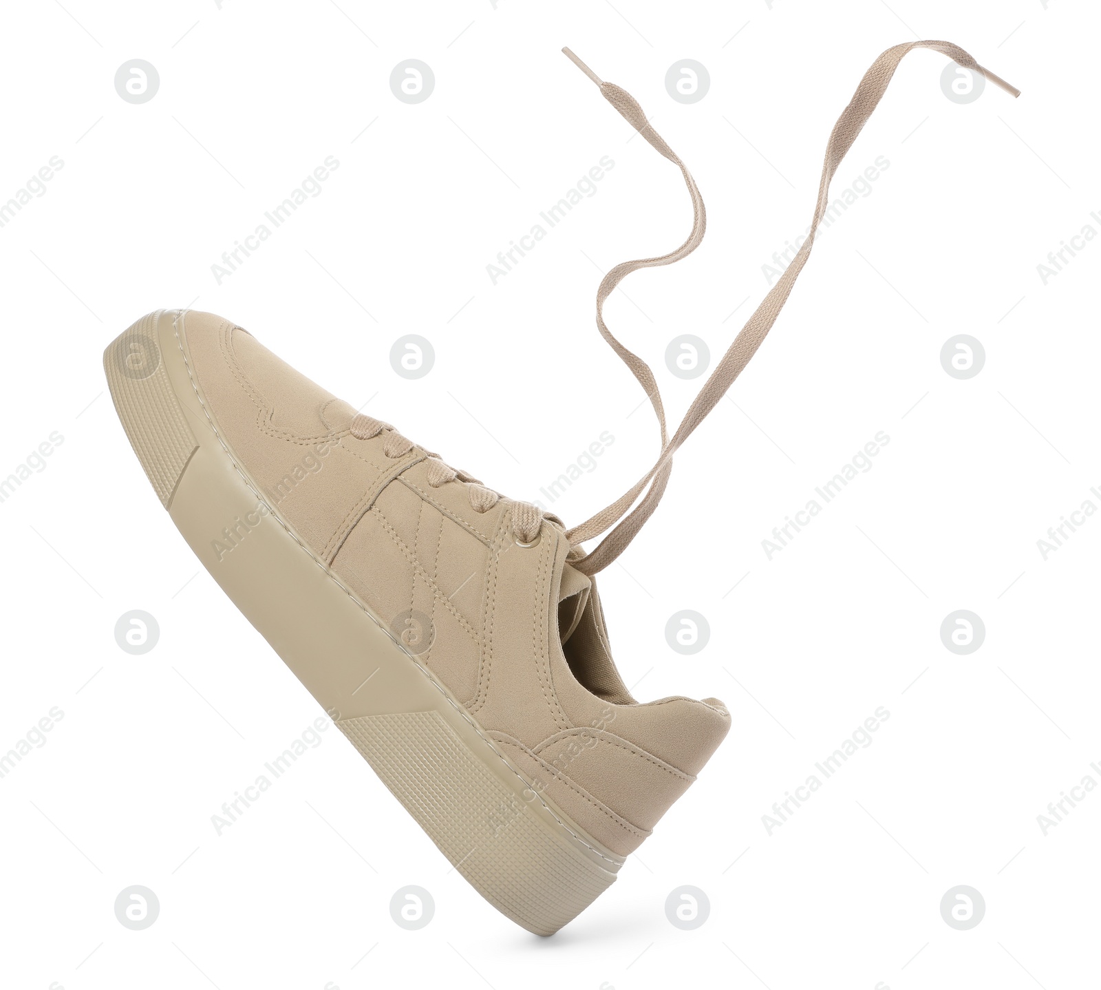 Photo of One stylish beige sneaker isolated on white