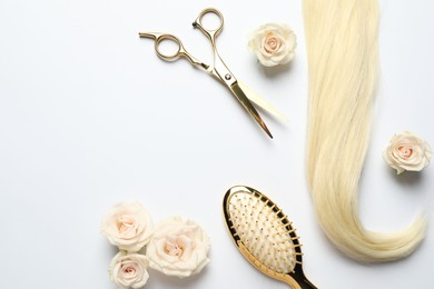 Photo of Hairdresser tools. Blonde hair lock, scissors, brush and flowers on white backpack, flat lay. Space for text