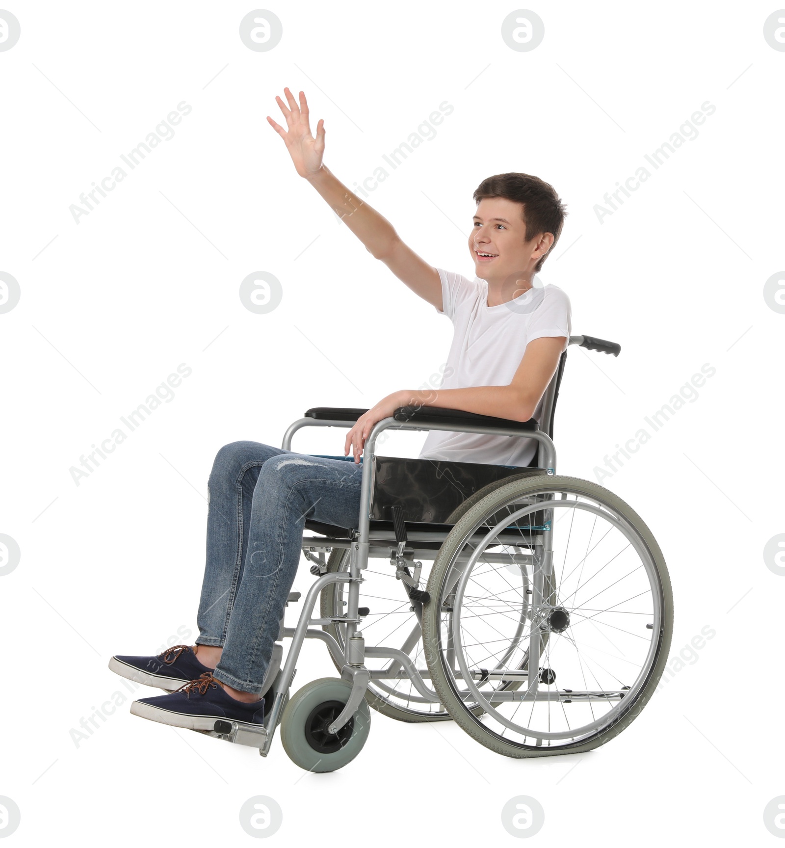 Photo of Teen boy in wheelchair on white background