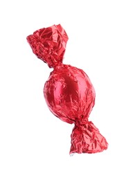 Tasty candy in red wrapper isolated on white