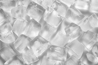 Photo of Pile of ice cubes on white background
