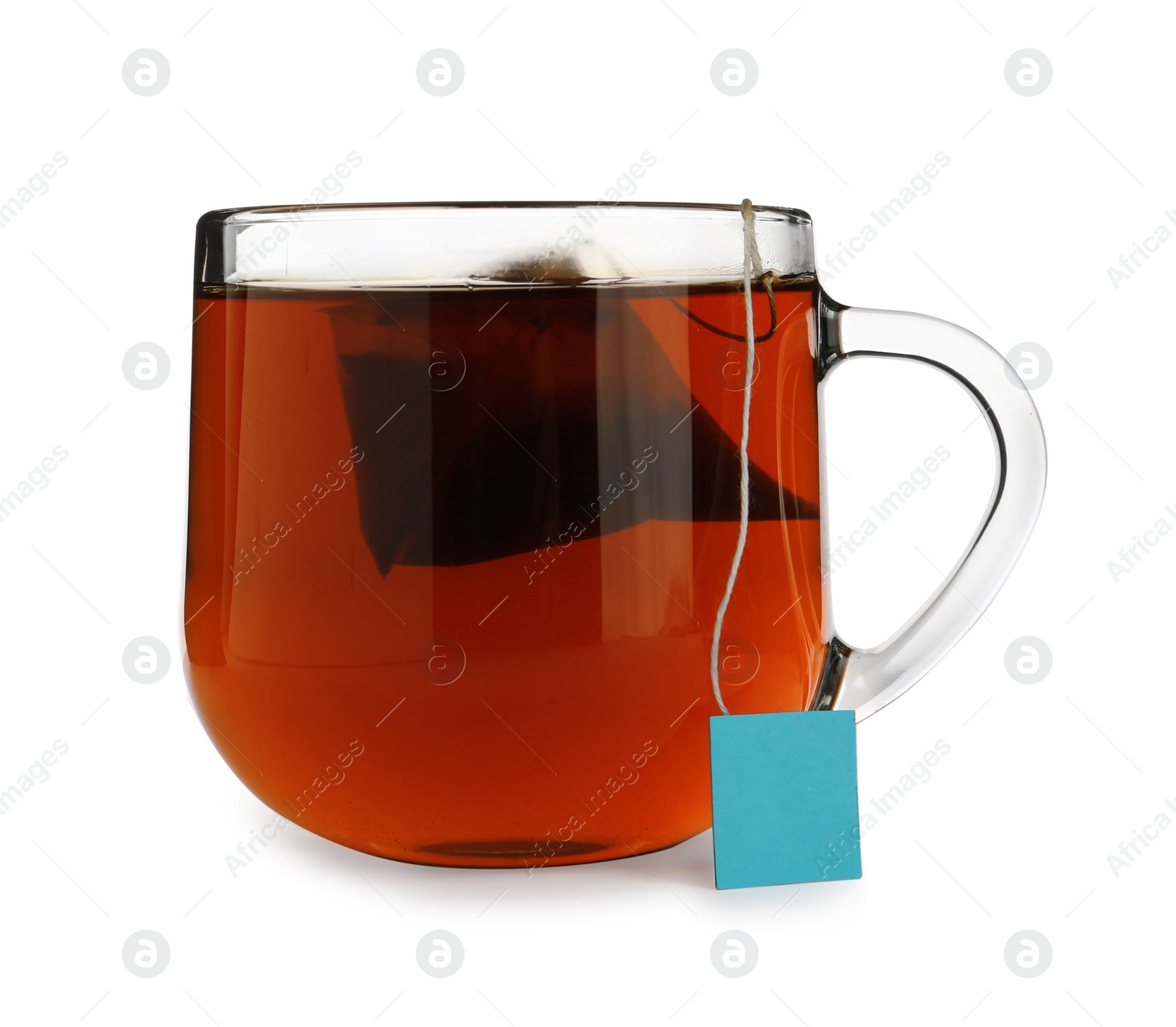 Photo of Tea bag in glass cup of hot water isolated on white