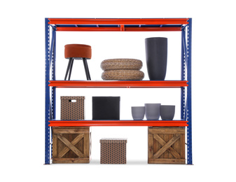 Photo of Bright metal shelving unit with wooden crates and different household stuff on white background