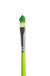 Brush with green paint isolated on white