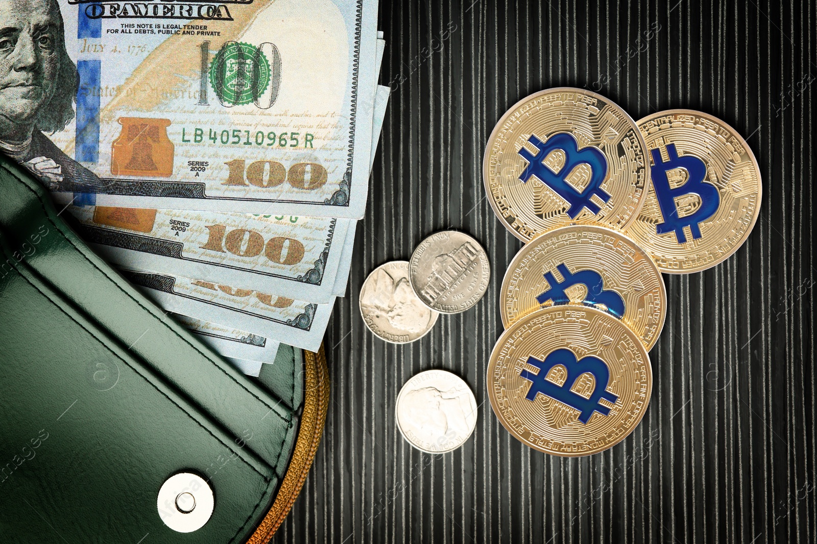 Image of Bitcoins, dollar banknotes, coins and wallet on black wooden background, flat lay