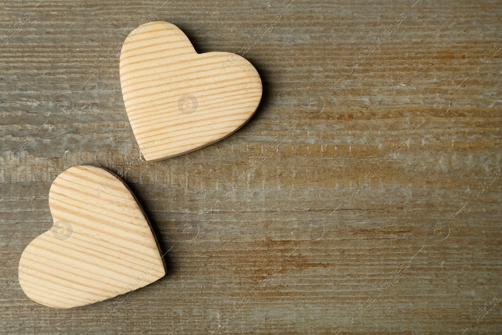 Photo of Decorative hearts and space for text on wooden table, flat lay. Valentine's Day