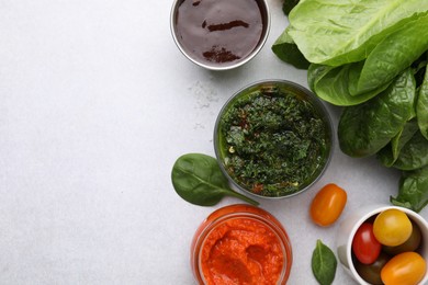 Photo of Different marinades and products on light table, flat lay. Space for text