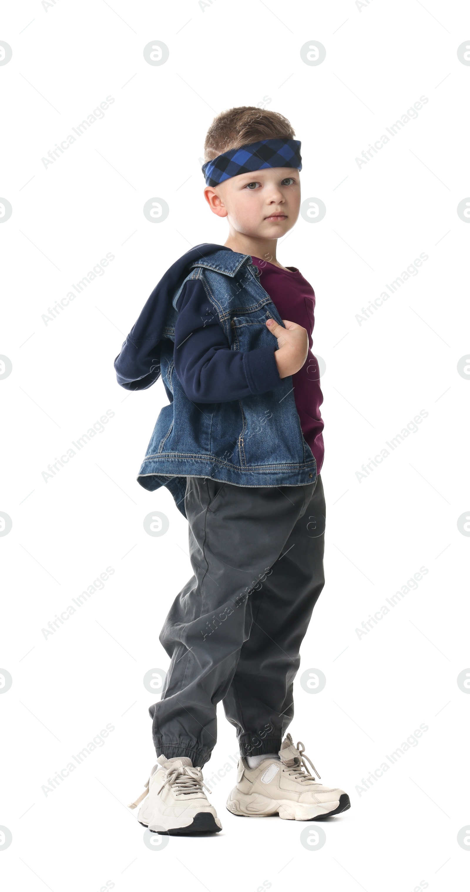 Photo of Happy little boy dancing on white background