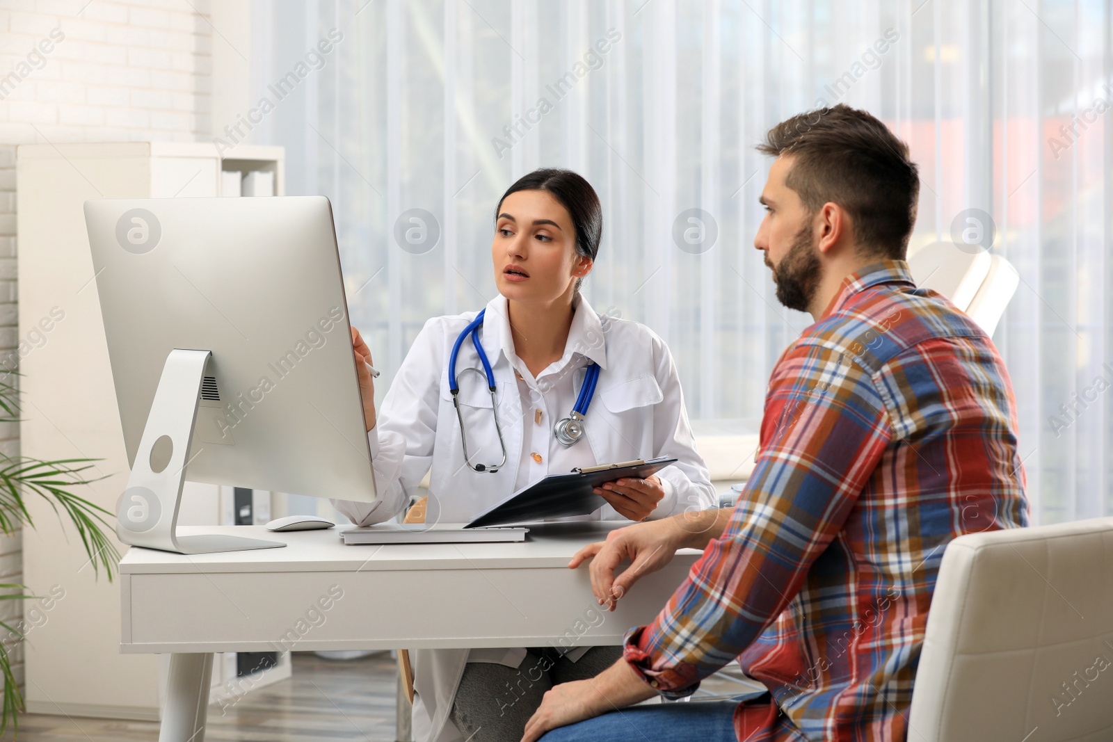 Photo of Man having appointment with neurologist in clinic