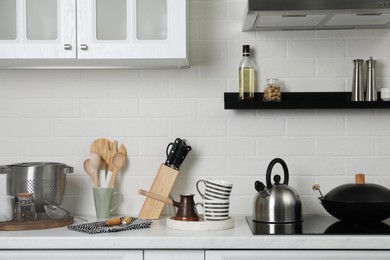 Countertop with different cooking utensils in kitchen