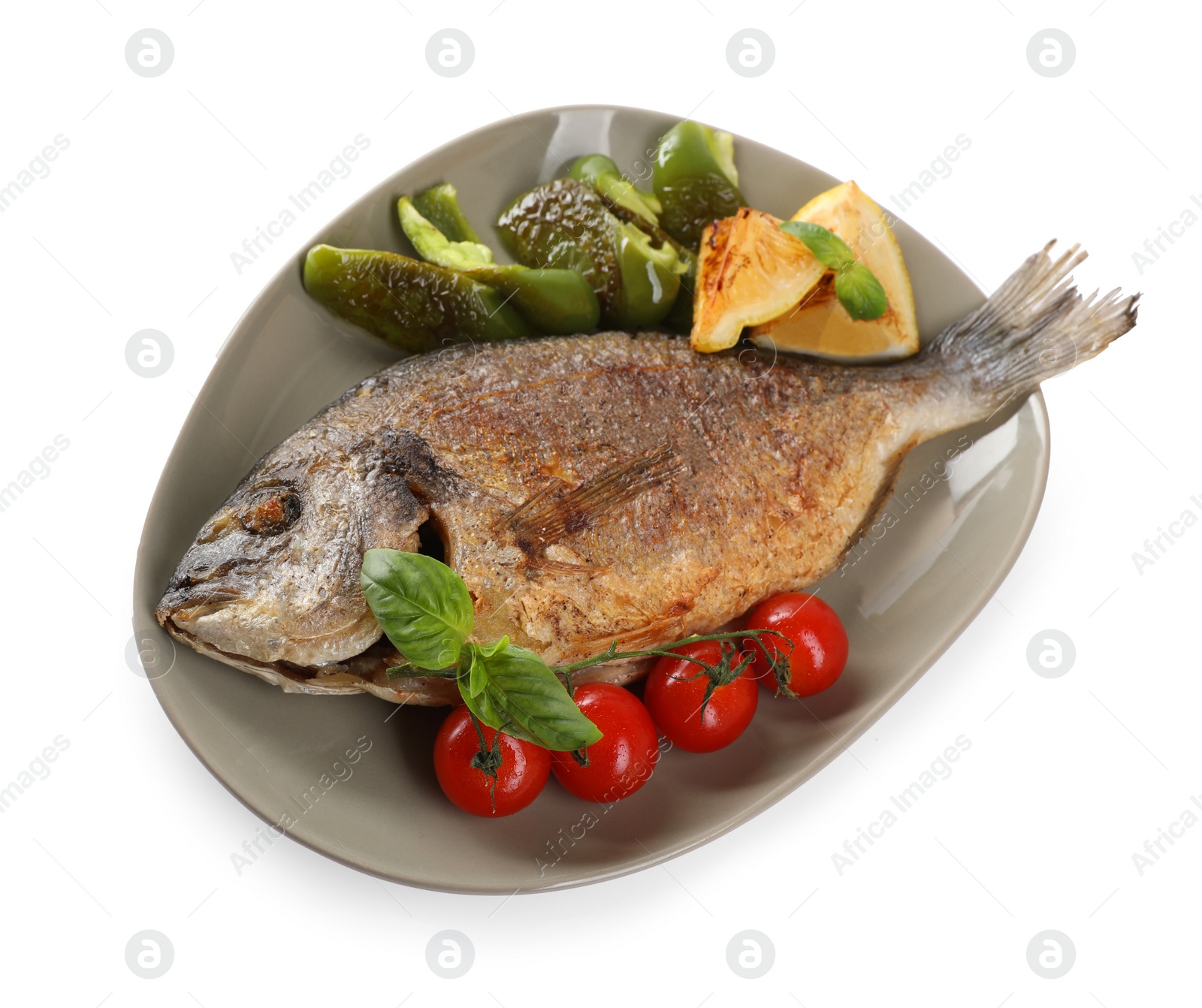 Photo of Delicious roasted dorado fish, vegetables, and lemon isolated on white, top view