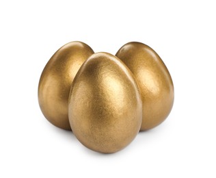 Many shiny golden eggs on white background