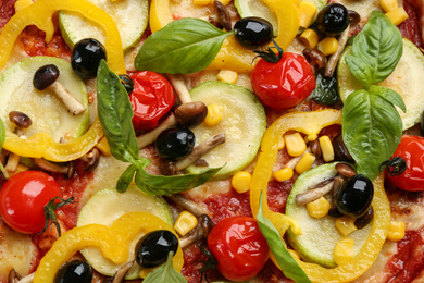 Photo of Delicious vegetable pizza as background, top view