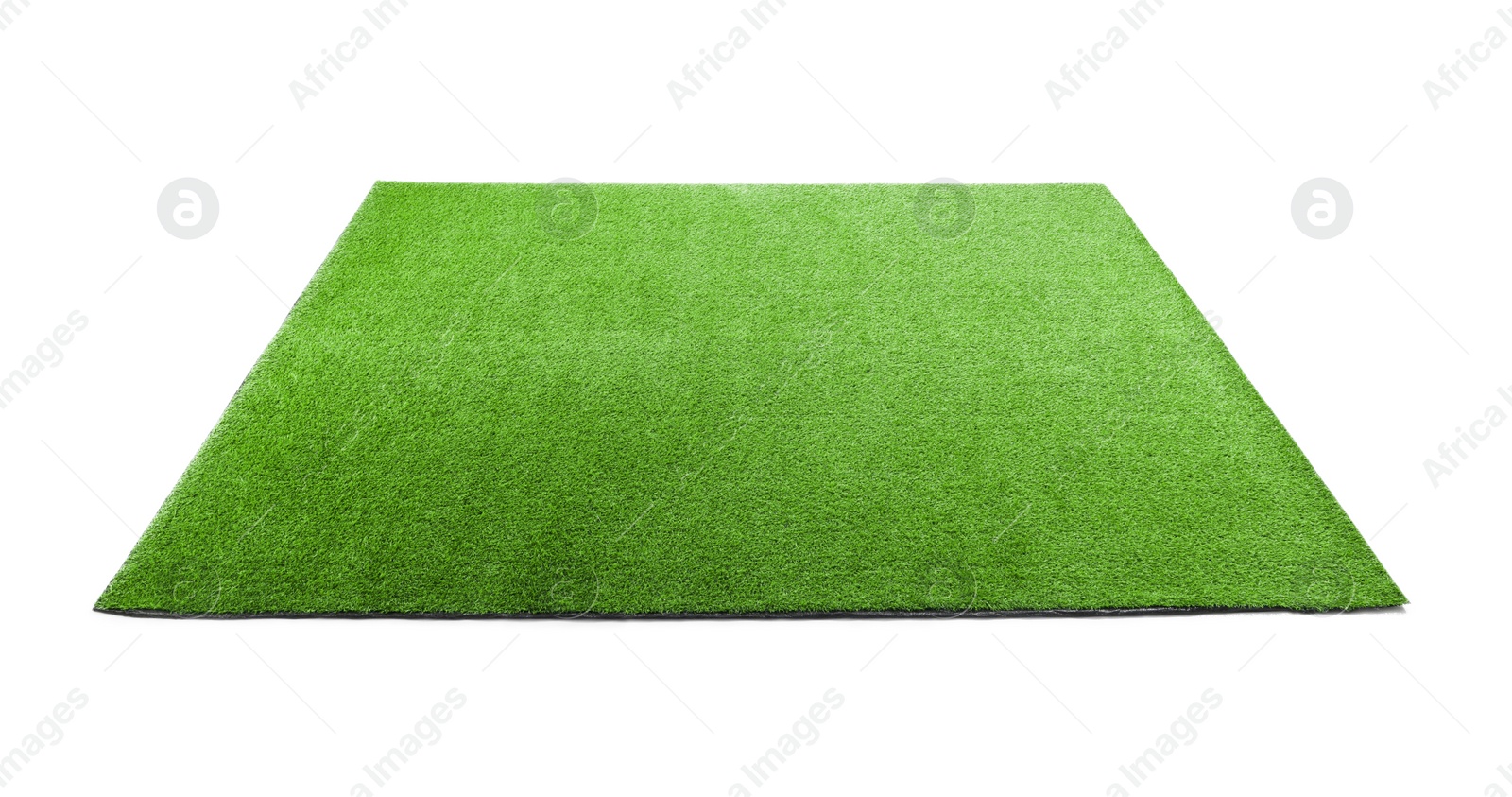 Photo of Green artificial grass carpet isolated on white