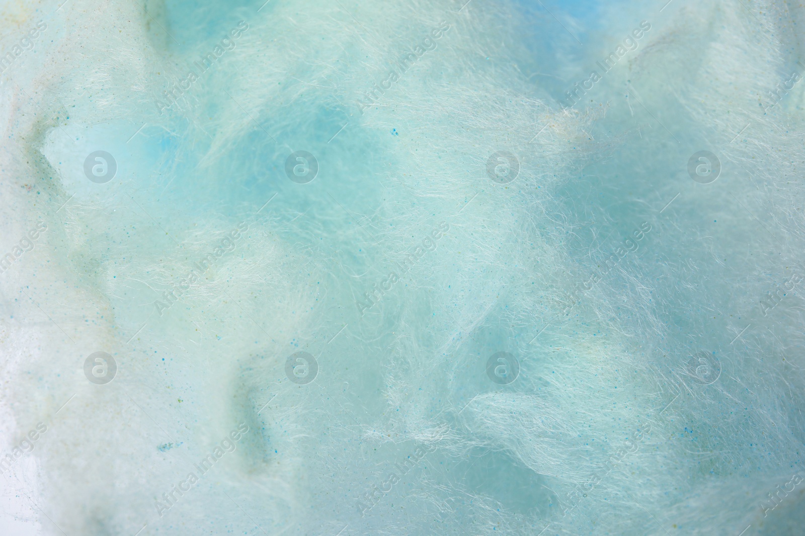 Photo of Sweet blue cotton candy as background, closeup view