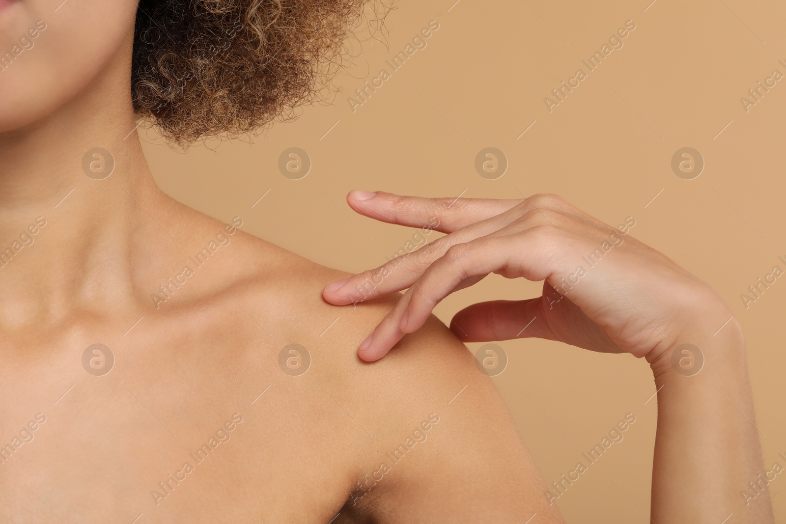 Photo of Beautiful woman with healthy skin on beige background, closeup