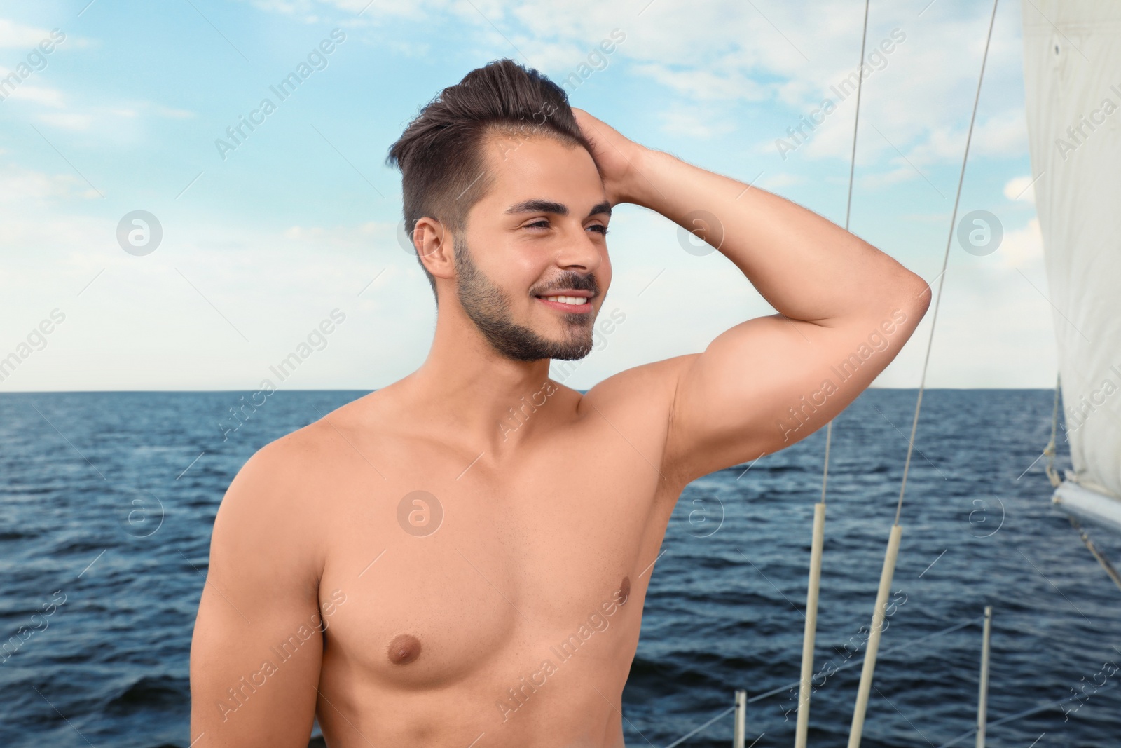 Photo of Young man resting on yacht at sea