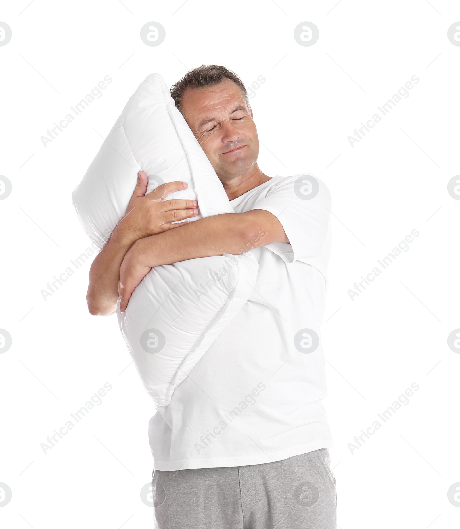 Photo of Man holding soft pillow on white background