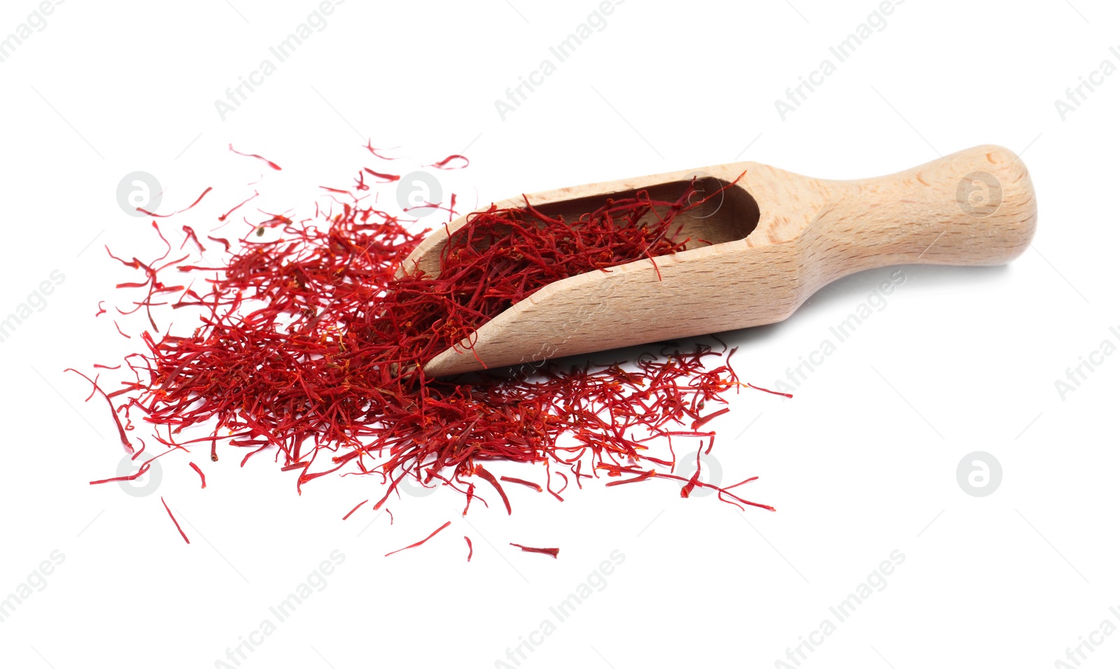 Photo of Aromatic saffron and scoop isolated on white