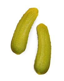 Halves of tasty pickled cucumber on white background, top view