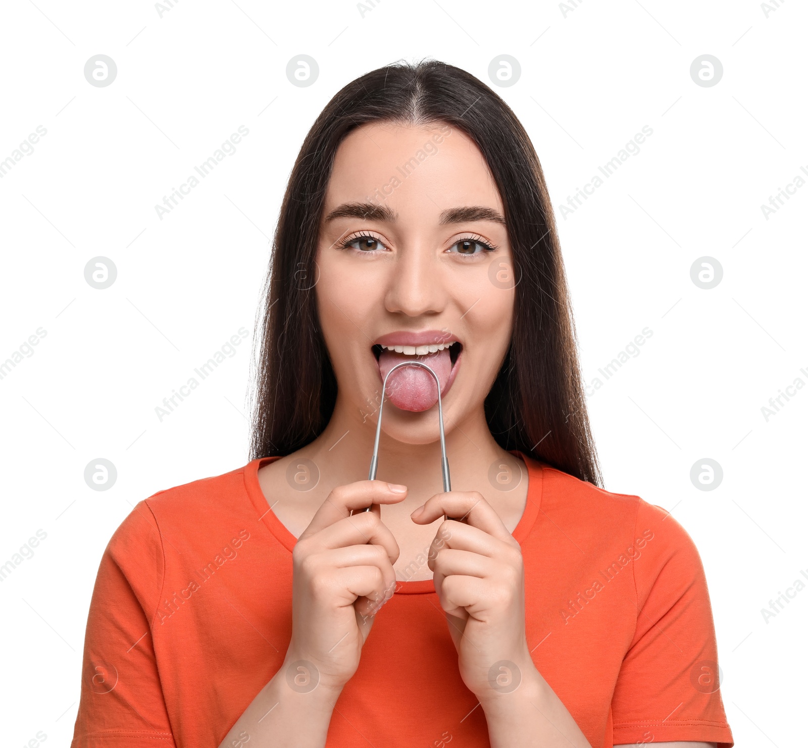 Photo of Happy woman brushing her tongue with cleaner on white background