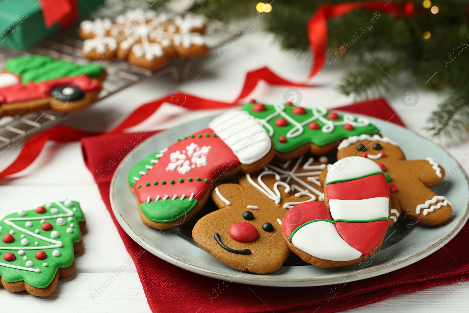 Photo of Tasty homemade Christmas cookies on white wooden table, closeup