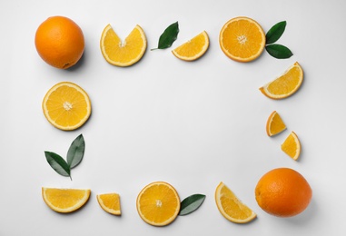 Photo of Frame made of fresh oranges on white background, top view with space for text