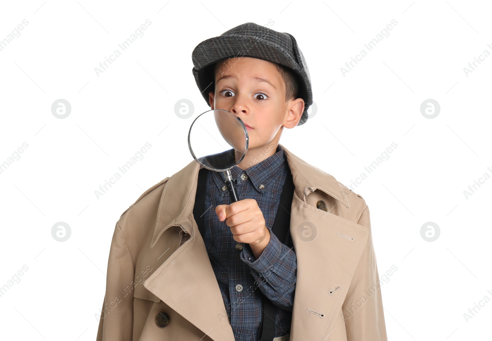 Photo of Little boy with magnifying glass playing detective on white background