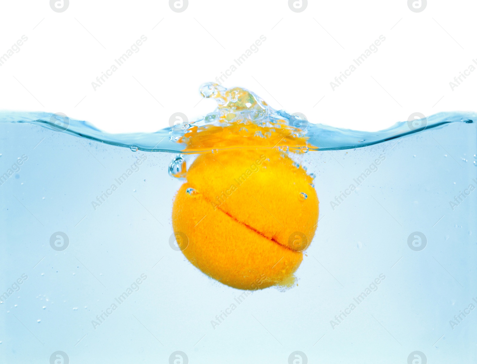 Photo of Bath bomb splashing into water on white background