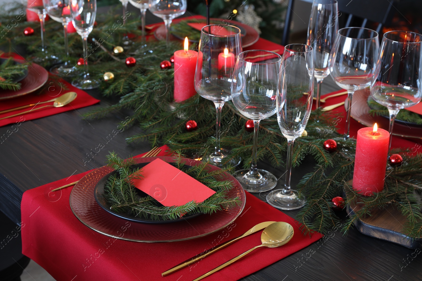 Photo of Elegant Christmas table setting with blank place card and festive decor