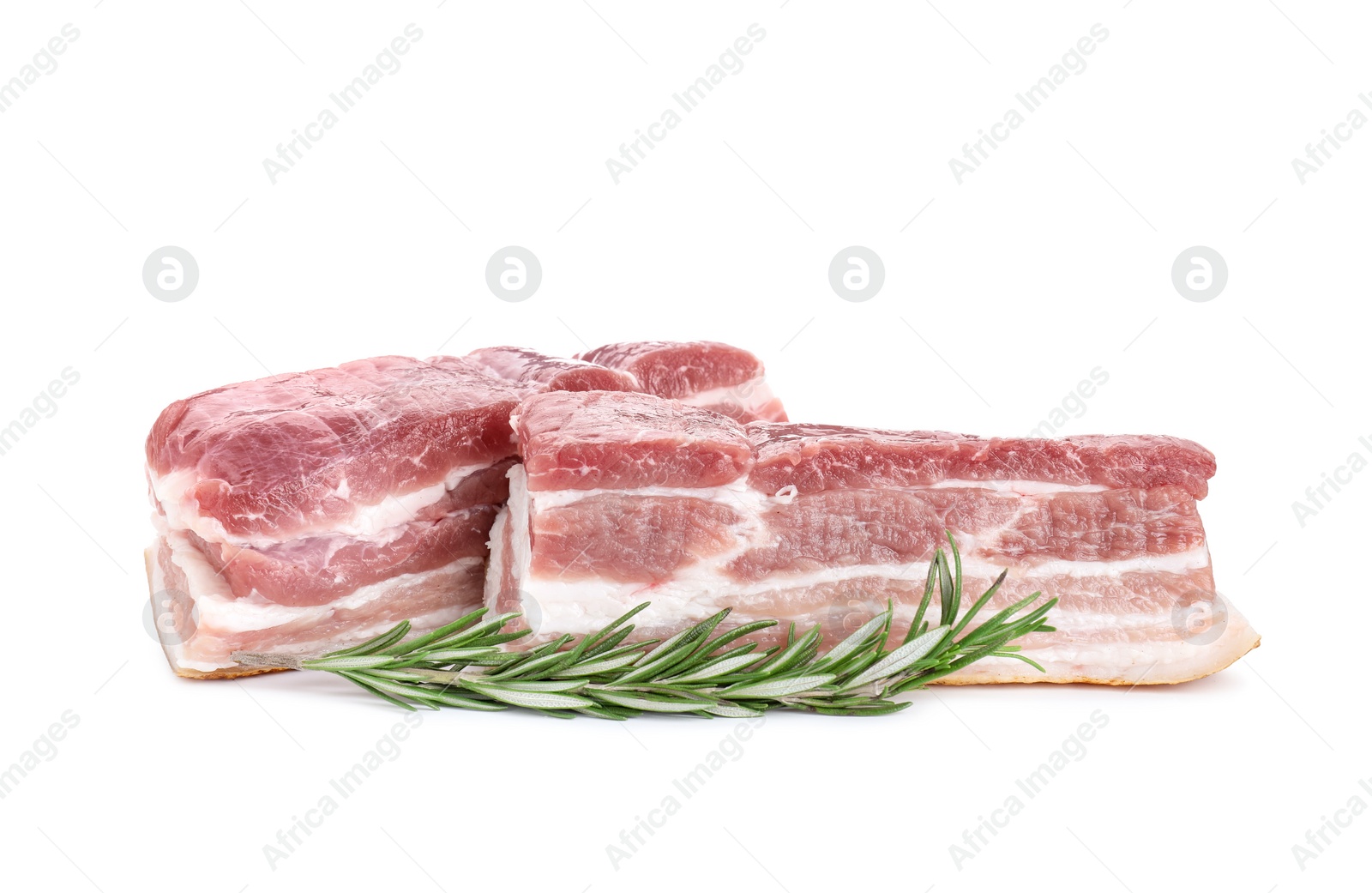 Photo of Pieces of raw pork belly and rosemary isolated on white