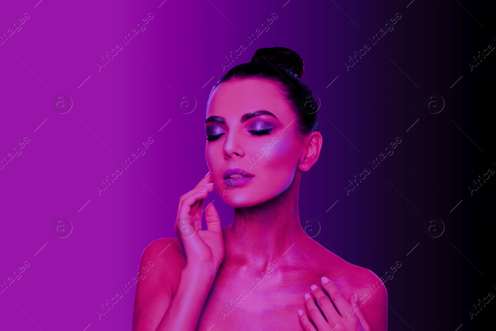 Image of Young woman with beautiful makeup posing in neon lights