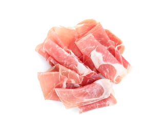 Slices of tasty prosciutto on white background, top view