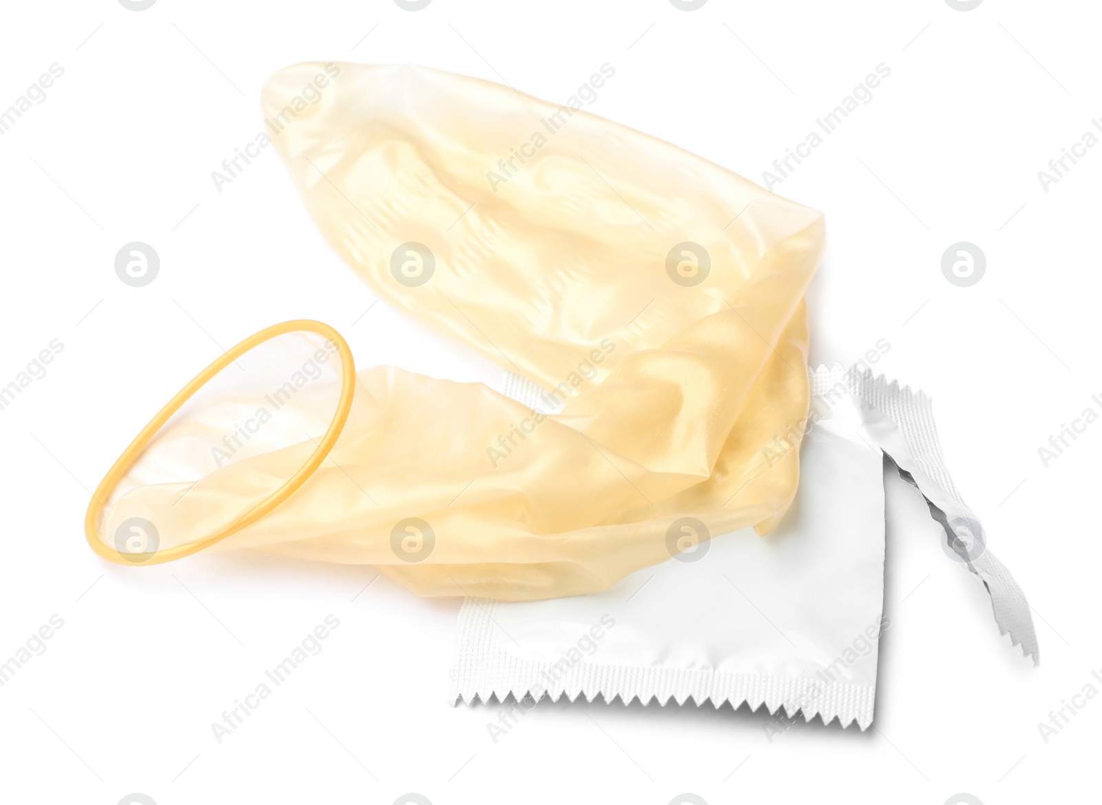 Image of Unrolled condom and package on white background. Safe sex
