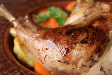 Photo of Tasty cooked rabbit meat in bowl, closeup