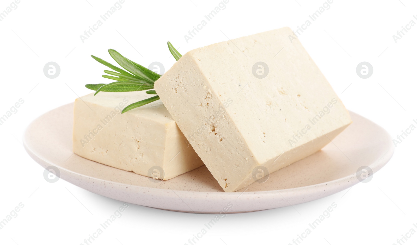 Photo of Plate with delicious raw tofu and rosemary isolated on white