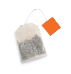 Photo of Paper tea bag with tag isolated on white, top view