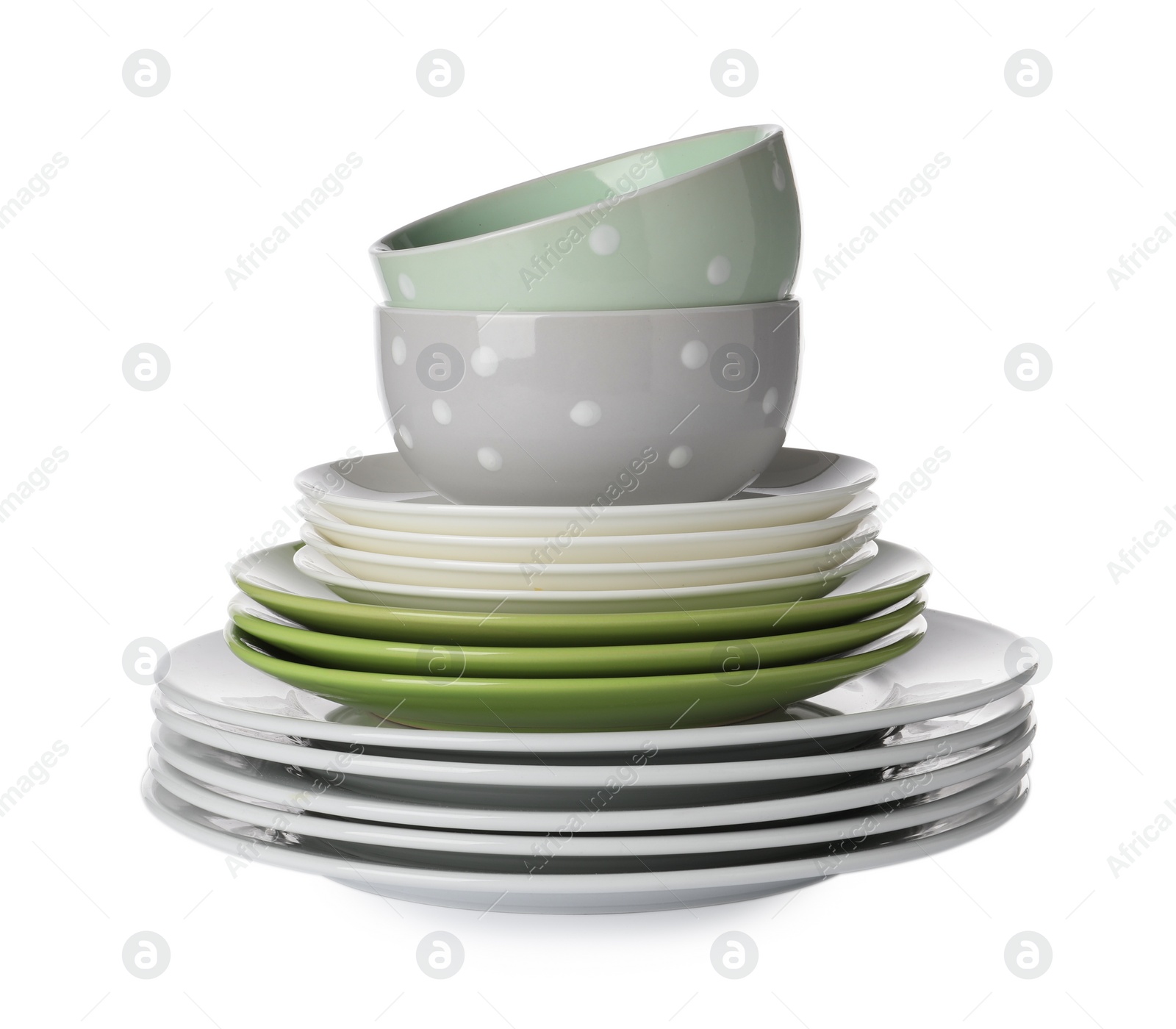 Photo of Beautiful ceramic plates and bowls isolated on white