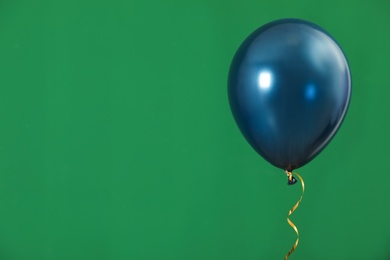 Bright balloon on color background, space for text. Celebration time