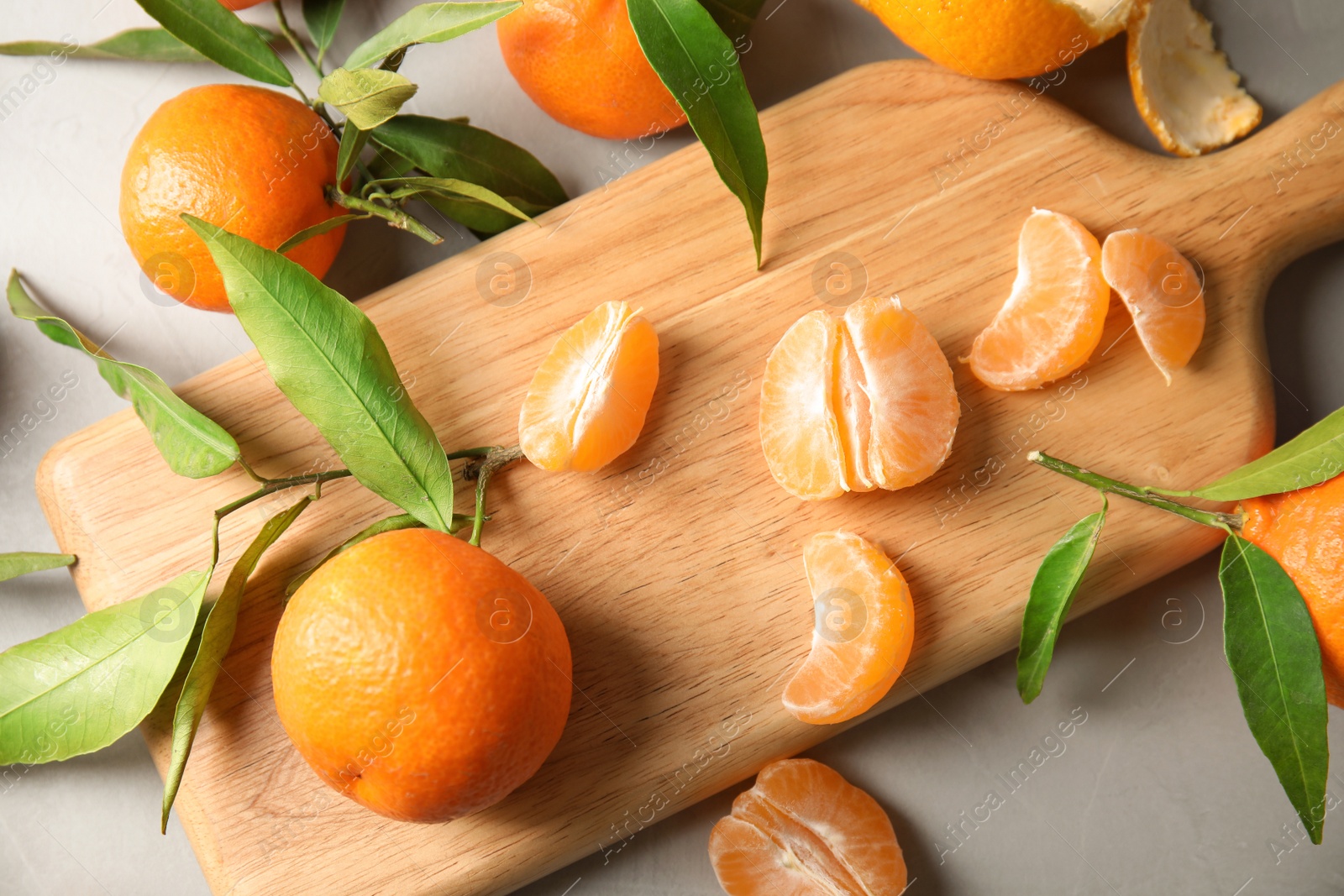 Photo of Flat lay composition with ripe tangerines on grey background