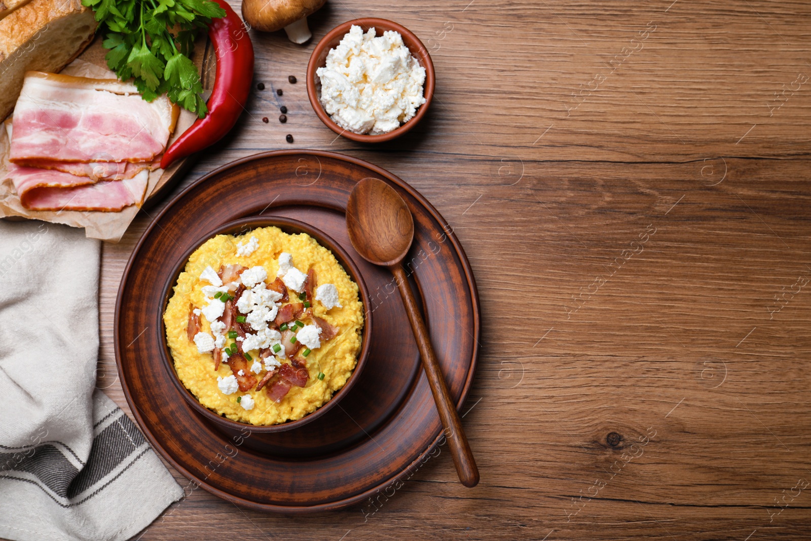 Photo of Delicious traditional banosh served on wooden table, flat lay. Space for text