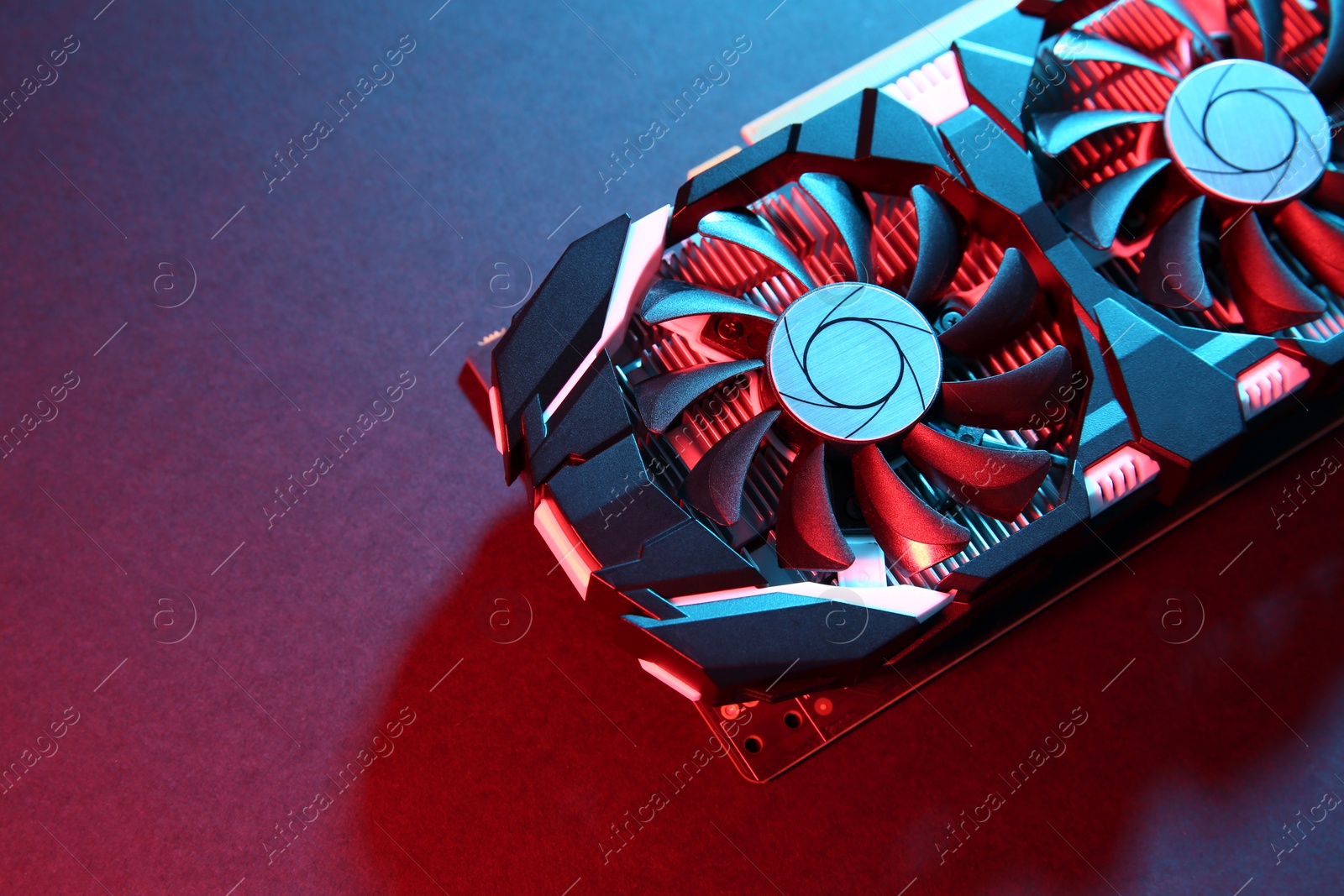 Photo of Computer graphics card on color background, top view. Space for text