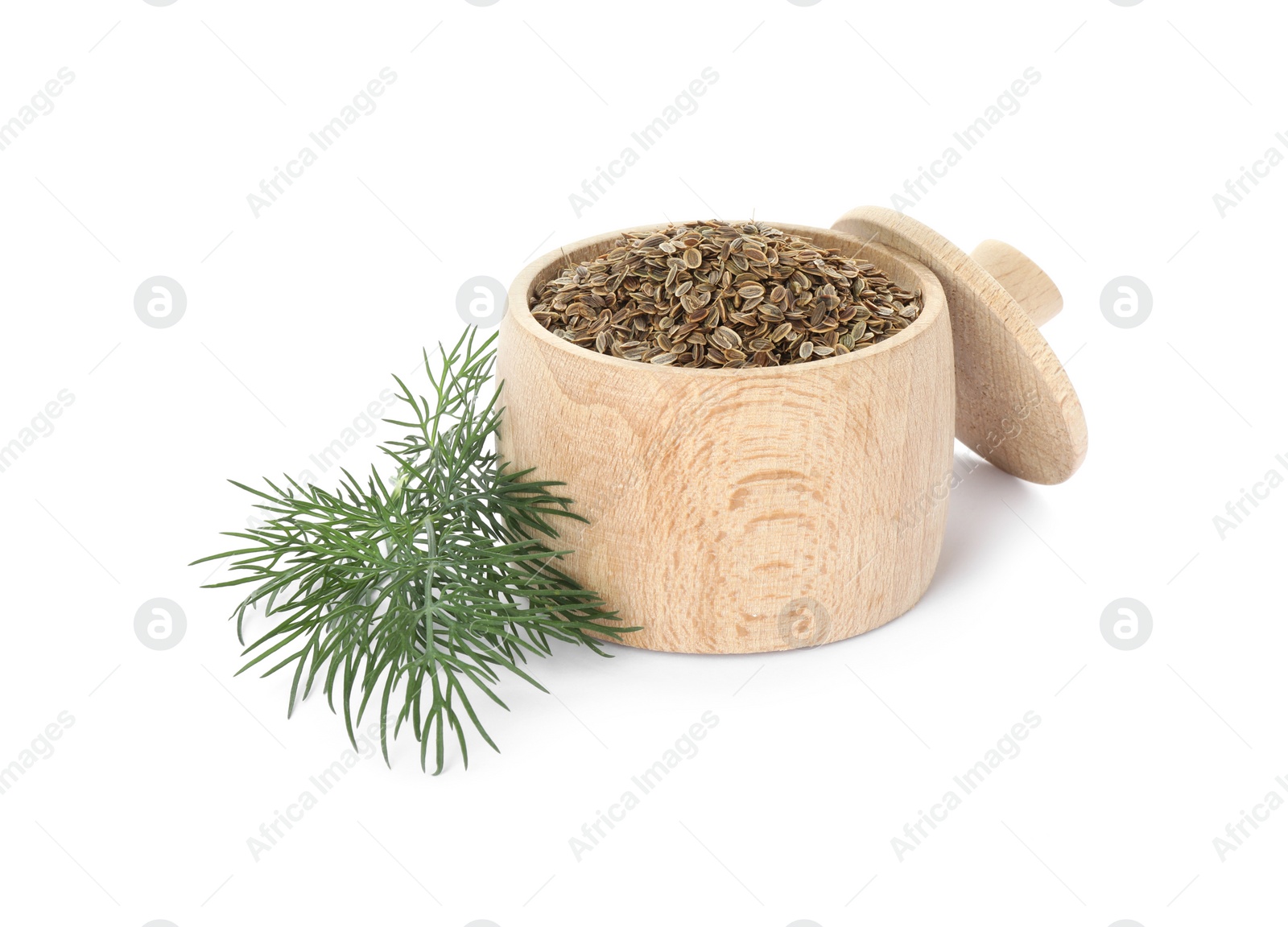 Photo of Wooden jar of dry seeds and fresh dill isolated on white