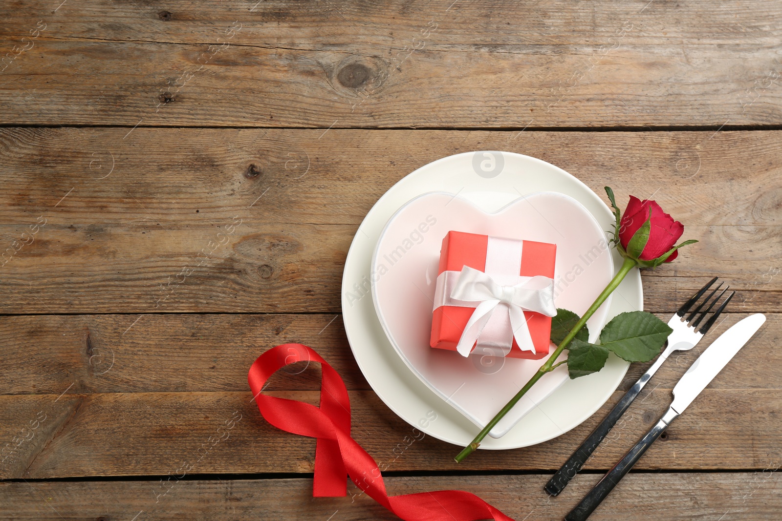 Photo of Beautiful table setting on wooden background, flat lay with space for text. Valentine's Day dinner