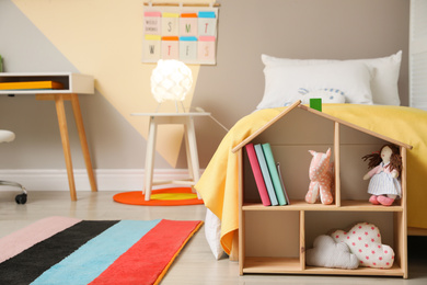 Stylish child room interior with comfortable bed and  toys