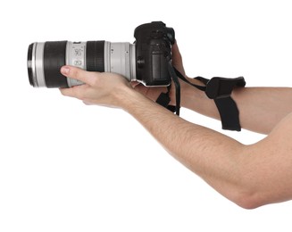 Photo of Photographer holding modern camera on white background, closeup