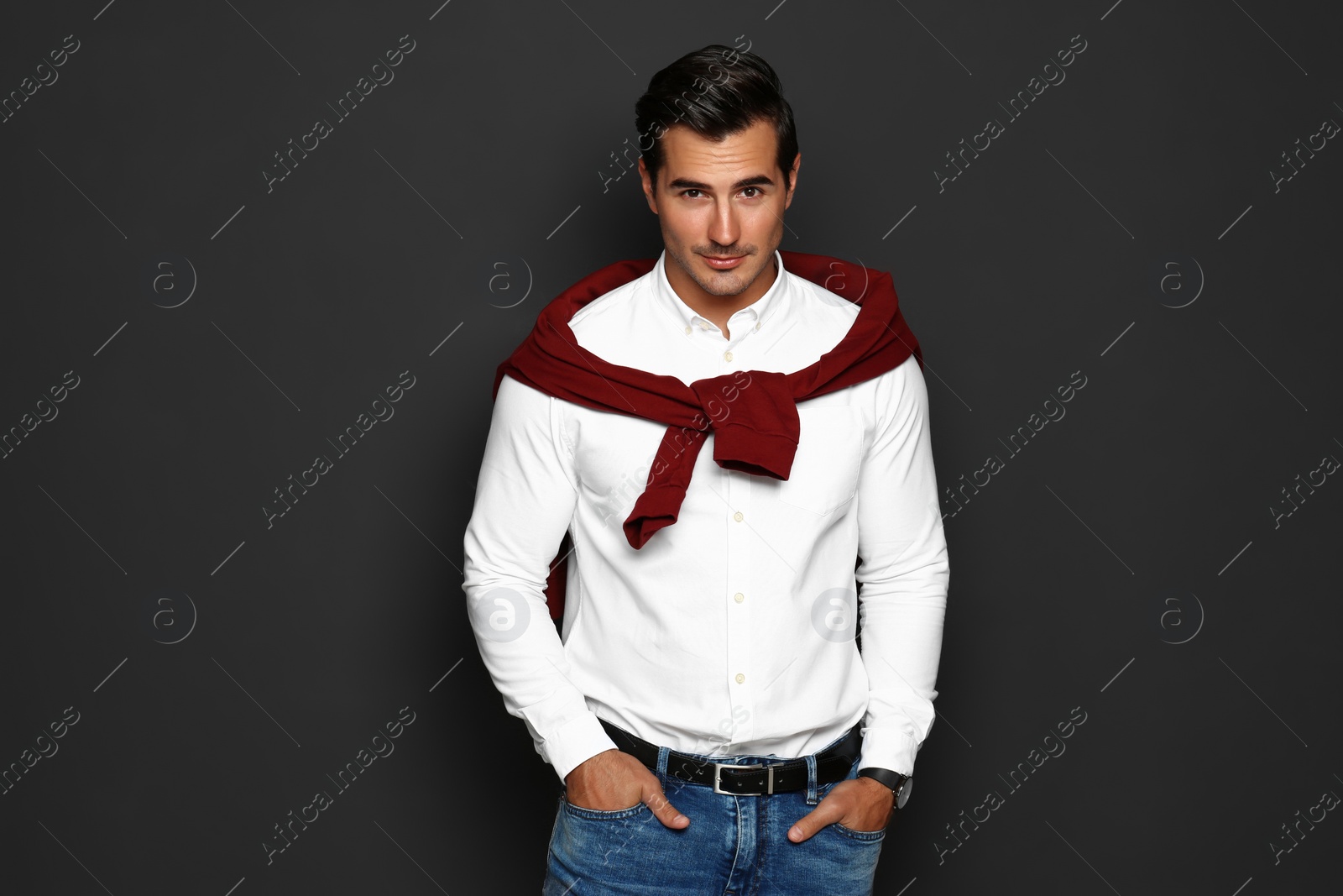 Photo of Portrait of handsome young man on dark background