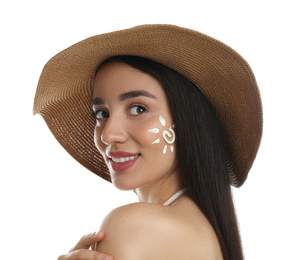 Young woman with sun protection cream on her face against white background