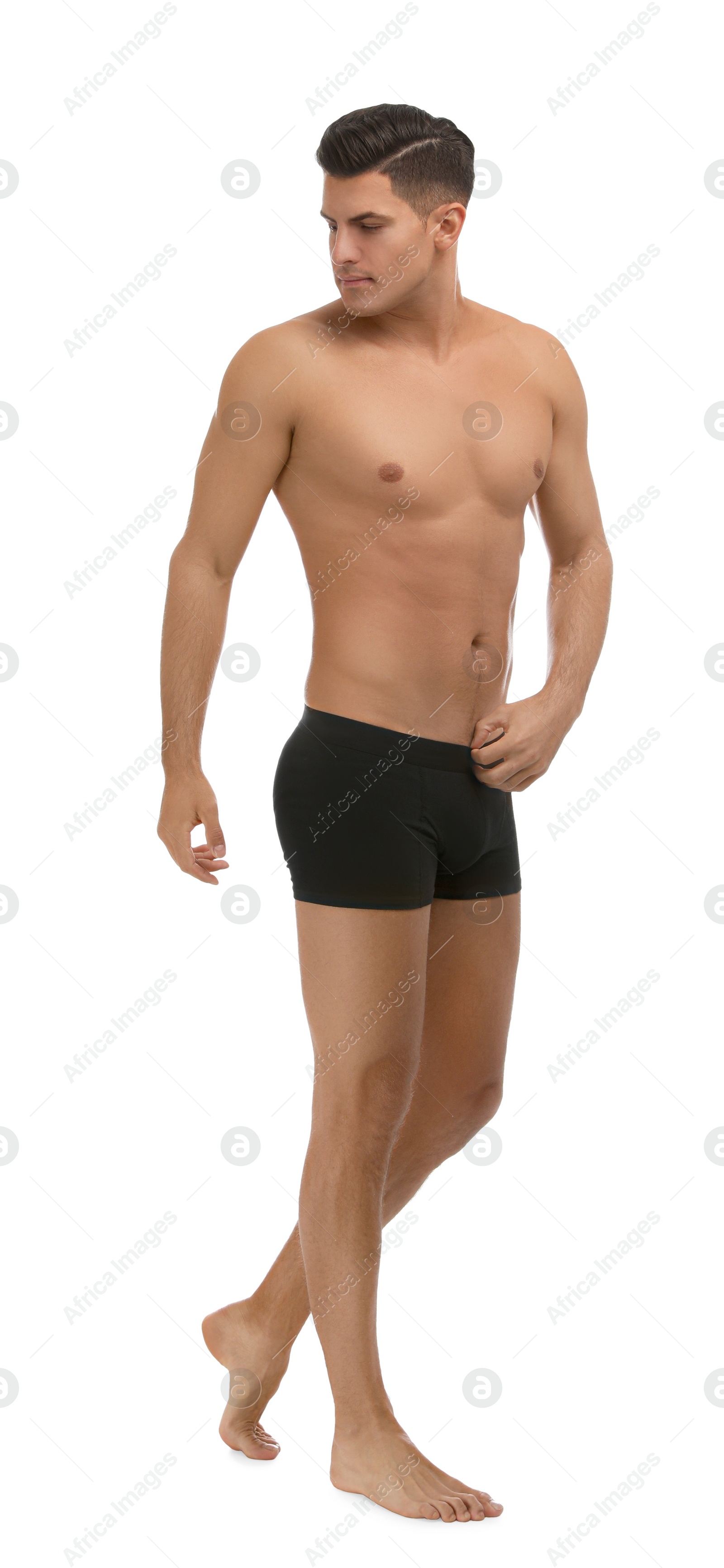 Photo of Handsome man in black underwear on white background